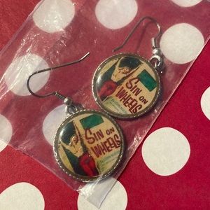 Never been used - Sin on wheels pinup earrings